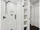 Bright, modern shower features glass doors, subway tile, and built-in shelving at 1406 Winston Pl, Decatur, GA 30033