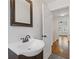 Bathroom vanity featuring dark wood, a white sink and tile floor at 1824 Westwood Sw Ave, Atlanta, GA 30310