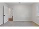 Bedroom featuring a soft carpet and natural light streaming through a window at 1824 Westwood Sw Ave, Atlanta, GA 30310