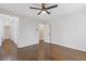 Spacious bedroom with hardwood floors, ceiling fan and an adjacent hallway at 1824 Westwood Sw Ave, Atlanta, GA 30310