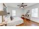 Bright bedroom featuring hardwood floors, ceiling fan and two windows that provide natural light at 1824 Westwood Sw Ave, Atlanta, GA 30310