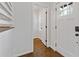 Bright foyer features hardwood floors, white trim, and a modern front door at 1824 Westwood Sw Ave, Atlanta, GA 30310