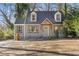 Charming home featuring dormer windows, a well-maintained yard, and a stylish front door at 1824 Westwood Sw Ave, Atlanta, GA 30310