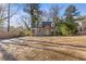 Quaint two-story home boasting a large front yard, updated siding, and a welcoming entrance at 1824 Westwood Sw Ave, Atlanta, GA 30310