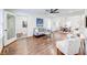 Open-concept living room with neutral decor, hardwood floors, and a view into the dining area at 1824 Westwood Sw Ave, Atlanta, GA 30310