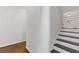 White staircase with dark wood steps and hardwood floors at 1824 Westwood Sw Ave, Atlanta, GA 30310