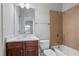 Bathroom featuring vanity, sink, toilet and tub with tile surround and shower at 4335 Hastings Dr, Cumming, GA 30041