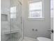 Bathroom featuring a tiled shower with glass doors at 4335 Hastings Dr, Cumming, GA 30041