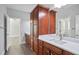 Bathroom vanity with double sinks, granite countertop, and wooden cabinets at 4335 Hastings Dr, Cumming, GA 30041