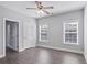 Bedroom featuring wood floors, neutral walls, and two windows allowing natural light at 4335 Hastings Dr, Cumming, GA 30041