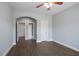 This bedroom features hardwood floors, ceiling fan and ensuite bathroom at 4335 Hastings Dr, Cumming, GA 30041