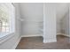 Well-organized walk-in closet featuring shelves, ample space, and a window for natural light, enhancing storage solutions at 4335 Hastings Dr, Cumming, GA 30041