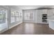 Sunlit dining area with stainless steel appliances, white cabinets, and a backyard view at 4335 Hastings Dr, Cumming, GA 30041