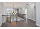 Second floor landing with decorative chandelier and wrought iron banister at 4335 Hastings Dr, Cumming, GA 30041