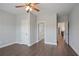 Hallway featuring wood floors and neutral walls, with doorways to bathroom and bedroom at 4335 Hastings Dr, Cumming, GA 30041