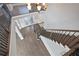 A staircase featuring hardwood steps and iron railings at 4335 Hastings Dr, Cumming, GA 30041