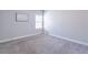 Bedroom with neutral carpet, bright natural light, and ample space at 965 Mulberry Bay Dr, Dacula, GA 30019