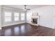 Inviting living room showcasing a stone fireplace, shiplap wall, and bright, airy windows at 965 Mulberry Bay Dr, Dacula, GA 30019