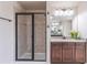 Bathroom featuring a glass-enclosed shower, granite counters, and modern lighting at 965 Mulberry Bay Dr, Dacula, GA 30019