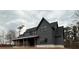 Stylish new construction showcasing dark siding, black framed windows, and architectural details at 157 Palisade Dr, Rydal, GA 30171