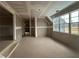 Unfinished living room ready for personalization, featuring large windows and ample natural light at 157 Palisade Dr, Rydal, GA 30171