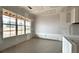 Bright living room featuring large windows offering ample natural light and scenic outdoor views at 157 Palisade Dr, Rydal, GA 30171
