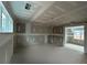 Spacious living room with large windows that fill the space with natural light at 157 Palisade Dr, Rydal, GA 30171