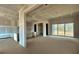 Unfinished living area with sliding glass doors, and kitchen area at 157 Palisade Dr, Rydal, GA 30171