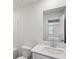 Bathroom featuring a sink, toilet and shower/bath combo with modern finishes at 2777 Aralynn Way, College Park, GA 30337