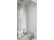 Bathroom featuring a large mirror, chrome faucet, and toilet with modern finishes at 2777 Aralynn Way, College Park, GA 30337