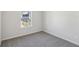 Bright bedroom featuring a window and plush carpeting for added comfort at 2777 Aralynn Way, College Park, GA 30337