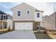 Charming two-story home with stone accents and a spacious two-car garage at 2777 Aralynn Way, College Park, GA 30337