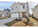 Beautiful two-story home with a stone-accented garage and well-maintained lawn at 2777 Aralynn Way, College Park, GA 30337