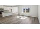 Open-concept living area with a view of the kitchen, enhanced by natural light at 2777 Aralynn Way, College Park, GA 30337