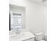 Bright bathroom with a clean white aesthetic featuring a mirror and modern faucet at 2778 Aralynn Way, College Park, GA 30337