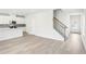 Bright and airy living room with hardwood floors, open to the kitchen and staircase at 2778 Aralynn Way, College Park, GA 30337