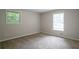 Neutral bedroom offers natural light, freshly painted walls, and new carpet at 467 Pineburr Ln, Stone Mountain, GA 30087
