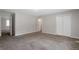 Large, neutral bedroom offering new paint and carpet, with a large window at 467 Pineburr Ln, Stone Mountain, GA 30087