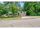 Charming split-level home with a well-maintained lawn and lush trees in a quiet neighborhood at 467 Pineburr Ln, Stone Mountain, GA 30087