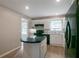Bright kitchen with white cabinets, black appliances and a center island with seating adds space at 467 Pineburr Ln, Stone Mountain, GA 30087