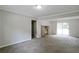 Open living area with a brick fireplace, access to the deck, and seamless flow at 467 Pineburr Ln, Stone Mountain, GA 30087
