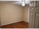 An inviting bedroom featuring hardwood floors and a ceiling fan for added comfort at 535 Clearwater Pl, Lawrenceville, GA 30044