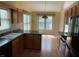 Functional kitchen with wood cabinets, laminate flooring, and stainless-steel appliances at 535 Clearwater Pl, Lawrenceville, GA 30044