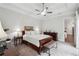 Comfortable bedroom features plush carpet, ceiling fan, and classic furniture, creating a cozy and inviting space at 642 Stickley Oak Way, Woodstock, GA 30189