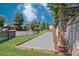 Community bocce ball court with mature trees and landscaping at 642 Stickley Oak Way, Woodstock, GA 30189