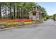 Well-maintained gated entrance with landscaping and stone features at 642 Stickley Oak Way, Woodstock, GA 30189