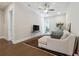 Cozy living room with hardwood floors and a comfortable sectional couch at 642 Stickley Oak Way, Woodstock, GA 30189