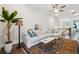 Bright living room area with a sectional sofa and a view of the staircase at 642 Stickley Oak Way, Woodstock, GA 30189