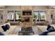 Bright living room with stone fireplace and outdoor views at 642 Stickley Oak Way, Woodstock, GA 30189