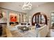 Open lounge area with modern lighting, comfortable seating, and large windows at 642 Stickley Oak Way, Woodstock, GA 30189